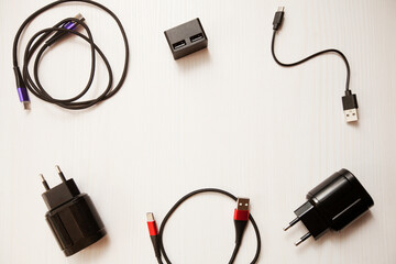 Chargers, usb cables, charging adapters on a white background. 