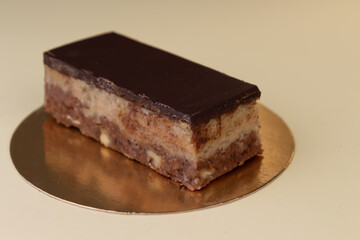 Traditional Croatian dessert Bajadera cake. Walnut and almond flour pralines covered with sweetened chocolate. Keto Dessert.