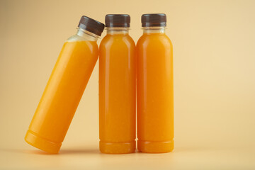 100% pulp organic fresh orange juice are in a bottles with brown cap