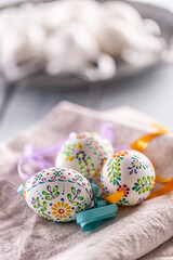 Handmade colorful easter eggs on a linen napkin