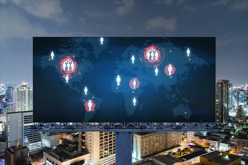 Hologram of Earth planet map on billboard over night panoramic cityscape of Bangkok. The concept of international companies in Southeast Asia.