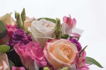 Close-up of a rose, a bouquet of different flowers. Spring or mother's day concept. Space for text