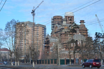 A building and a church are under construction (zoomed)