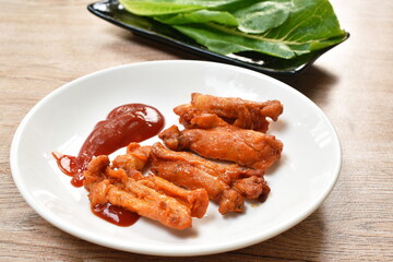 roasted barbecue chicken rib with honey sauce dipping ketchup on plate eat couple fresh cos vegetable salad
