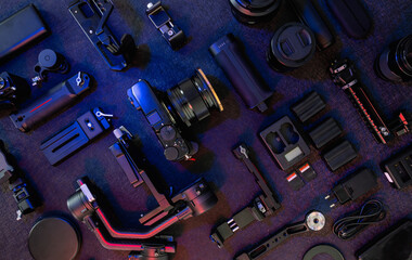 top view of work space photographer with digital camera, Gimbal Stabilizers and camera accessory