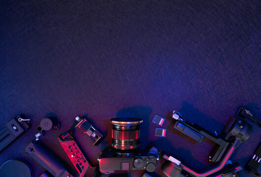 top view of work space photographer with digital camera, Gimbal Stabilizers and camera accessory