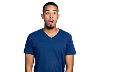 Young african american man wearing casual t shirt afraid and shocked with surprise expression, fear and excited face.
