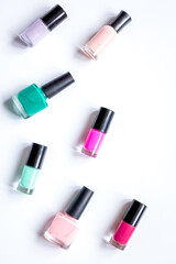 hands care concept with nail polish white desk background top view mock-up