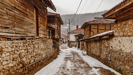 Fototapeta na wymiar Bulgaria Koprivshtitsa old city cobblestone street in winte