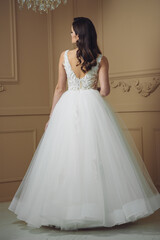 Beautiful sensual bride in light interior