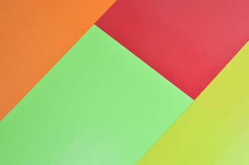 Top view of orange, yellow, red and green background