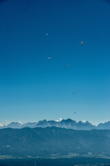 Paragliders flying above Mt. Gerlitzen