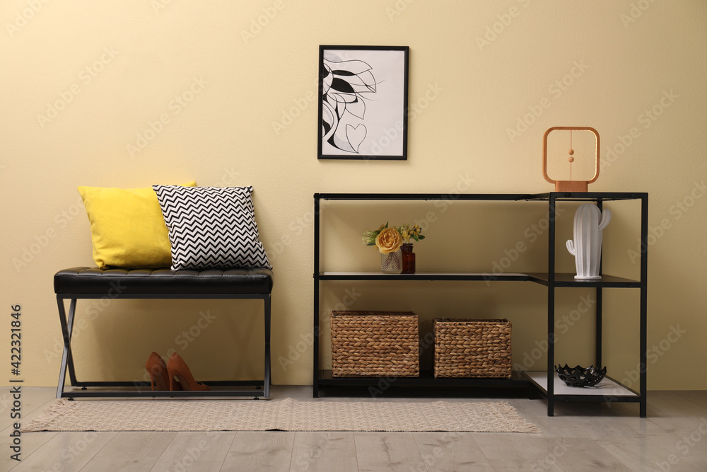 Canvas Prints Console table with decor and bench near beige wall in hallway. Interior design