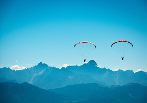 Paragliders flying above Mt. Gerlitzen