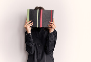  European girl in a black shirt with notebooks