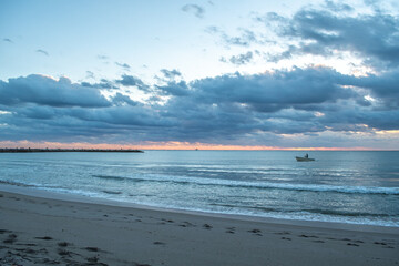 Sunrise Sunset cloudy sky over the Atlantic Ocean in Fort Pierce small town in Florida east coast