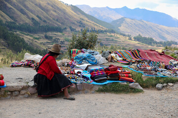 Peruvian vendor selling fabrics and souvenirs