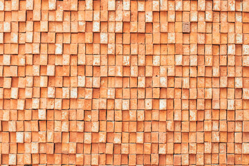 Rectangular orange bricks random pattern wall facade