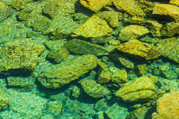The stones under the pond, close-up as a background.