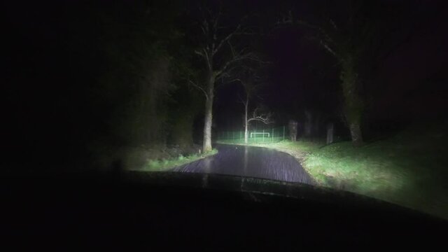Car riding on the road by rainy night