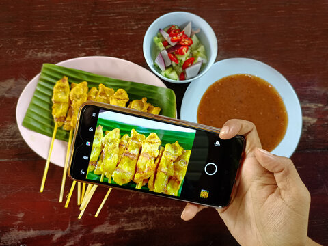 Pork satay with peanut sauce and cocomber salad are very delicious and popular food in Thailand. 