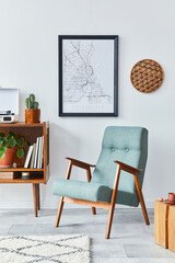 Retro composition of living room interior with mock up poster map, wooden shelf, book, stool, armchair, plant, cacti, vinyl recorder and personal accessories in stylish home decor.
