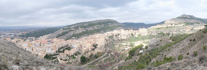 Panoramic view of Hanged Houses (Casas Colgadas) and San Pablo bridge in Cuenca (Spain) taking from a hill.