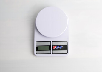 Digital kitchen scales on gray background. Copy space