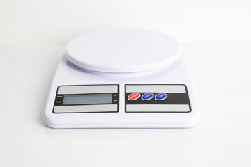 Digital kitchen scales on gray background. Copy space