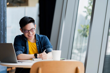 Smart attractive positive asian business male wearing glasses work remote new normal lifestyle hand...
