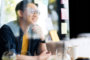 Smart attractive positive asian business male wearing glasses work remote new normal lifestyle hand use laptop tele conference onlive videocall meeting remote business ideas concept