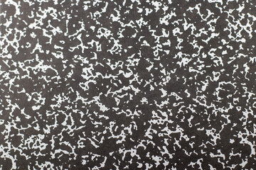 Abstract pattern with different white squiggles on black textured background