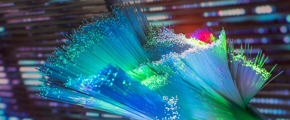 Fiber optics network cable on technology background