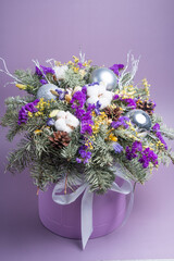 Coniferous Christmas bouquet in a hatbox. Green bouquet of Christmas tree branches