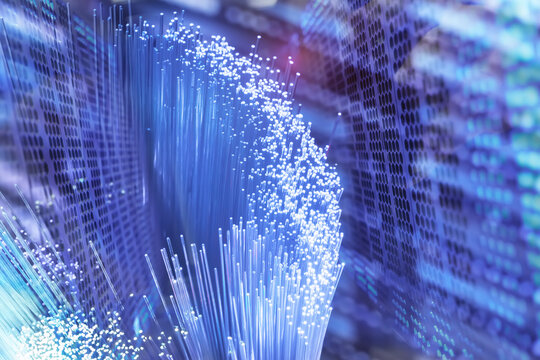 Fiber optics network cable on technology background