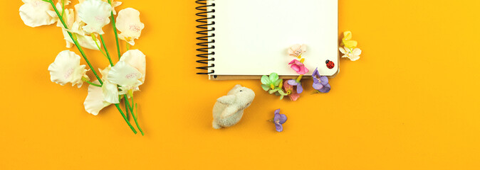 Easter template banner with spring and dried flowers on a yellow background