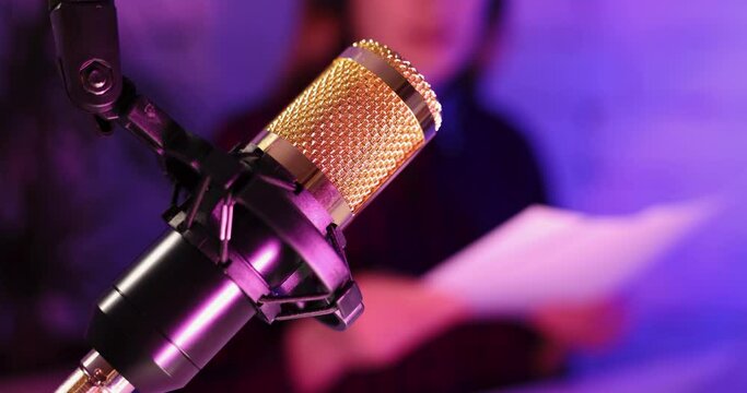 recording podcast - podcaster radio station host working in studio. microphone closeup