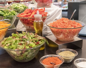 The regional cuisine of Israel in a hotel. Different types of fresh salads. Buffet etiquette