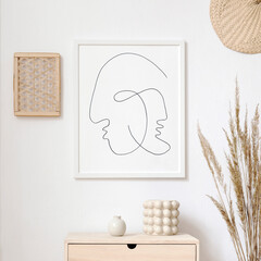 Stylish neutral interior of living room with white mock up poster frame, elegant rattan...