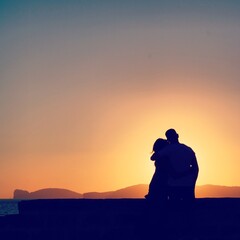 silhouette of a couple in the sunset