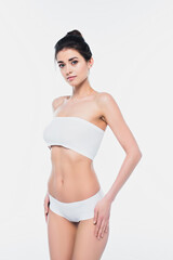 Obraz premium Pretty woman in underwear looking at camera isolated on white