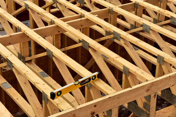 Wood floor joists between first and second floor of  new apartment complex under construction. - obrazy, fototapety, plakaty