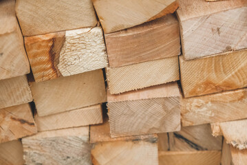 Wooden boards stacked on a pile as a background texture. Copy, empty space for text