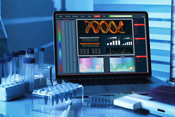 computer with genetic sequencing software screen on Genetic Research Laboratory Workbench. DNA...