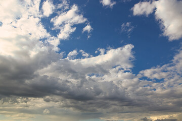Fototapeta premium dramatic blue sky with rays and white clouds