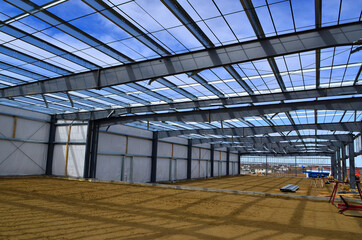 Steel beams and framing members from interior of new commercial building of expanding business.