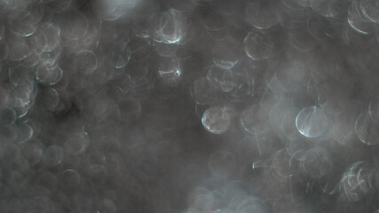 Abstract silver glitter sparkle defocused light background
