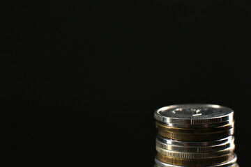 Many coins on a black background