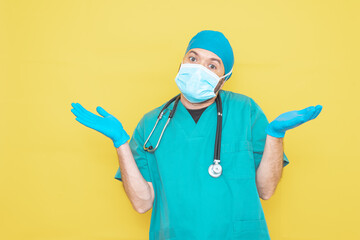 doctor dressed as a surgeon in green with stethoscope and mask on a yellow background with a...