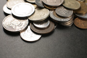Many coins on a black background